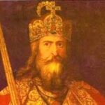 Portrait of a regal king in a jeweled crown and ornate robes, holding a staff or scepter.