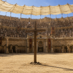 Large ancient amphitheater crowded with spectators; a wooden cross stands on the dusty arena floor at center.
