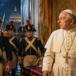 Papal figure in white cassock and cross necklace looks to the side as soldiers in Napoleonic uniforms enter a gilded room with St. Peter's Basilica visible through the doorway.