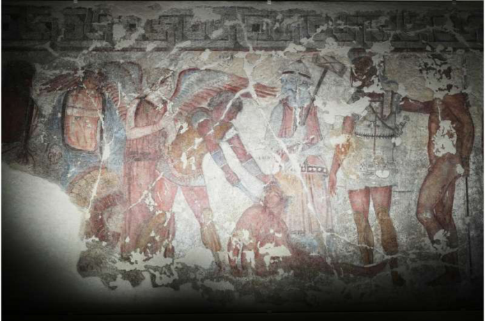 Faded ancient wall fresco showing soldiers in armor engaged in combat with shields and spears.