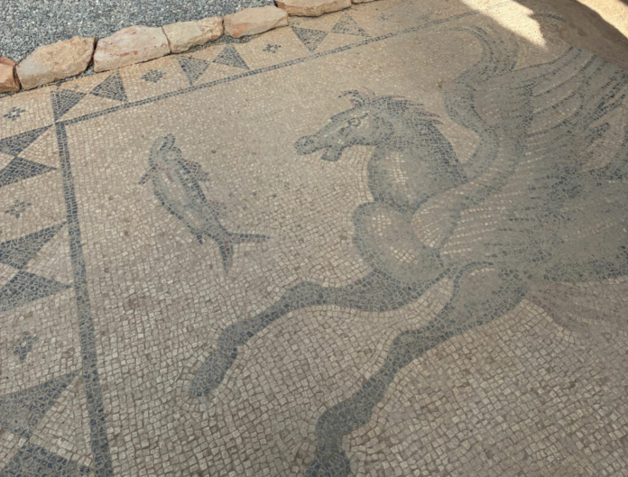 Turkey_Hippocampus_Mosaic Ancient mosaic floor with a large dragon-like creature pursuing a small human figure.