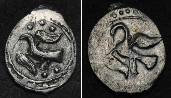 Russia_Kolomna Front and back of an ancient coin featuring a stylized bird design; left side shows a bird within a dotted border, right side displays a curved, abstract bird motif.