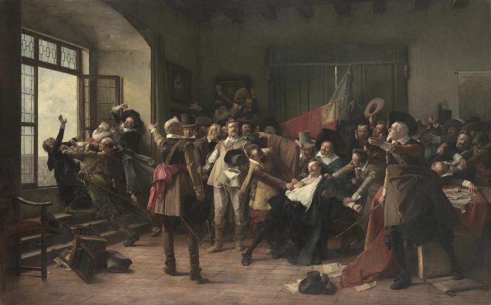 Guerra dei trent'anni: la defenestrazione di Praga del 1618 nel dipint Crowded 19th-century room as men confront and restrain a central figure while others watch and gesticulate.